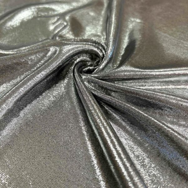 Plonas blizgus audinys