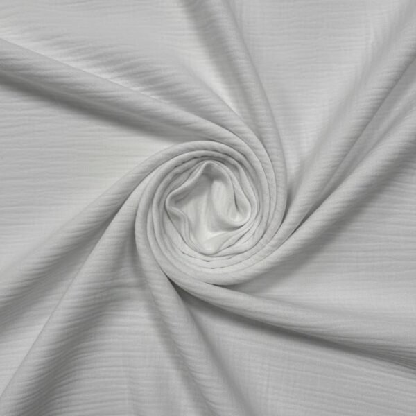 Baltas medvilninis muslino audinys su natūralia tekstūra