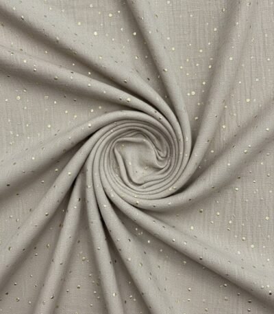 Medvilninis audinys su smulkiais taškeliais iš arti