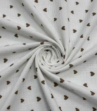 Medvilninis muslinas su smulkiu širdelių raštu