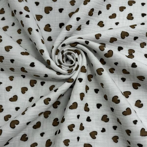 Medvilninis muslinas su smulkiu širdelių raštu