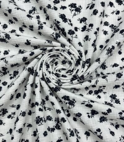 Medvilninis muslinas su smulkiu tamsių gėlyčių raštu